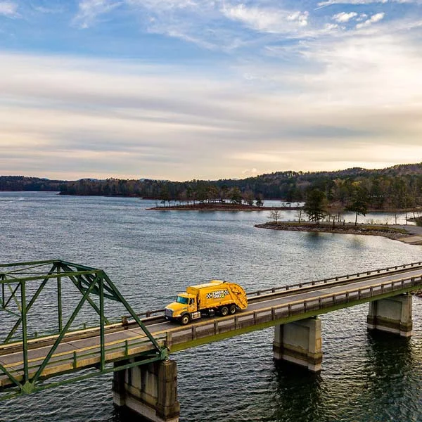 trash truck on bridge