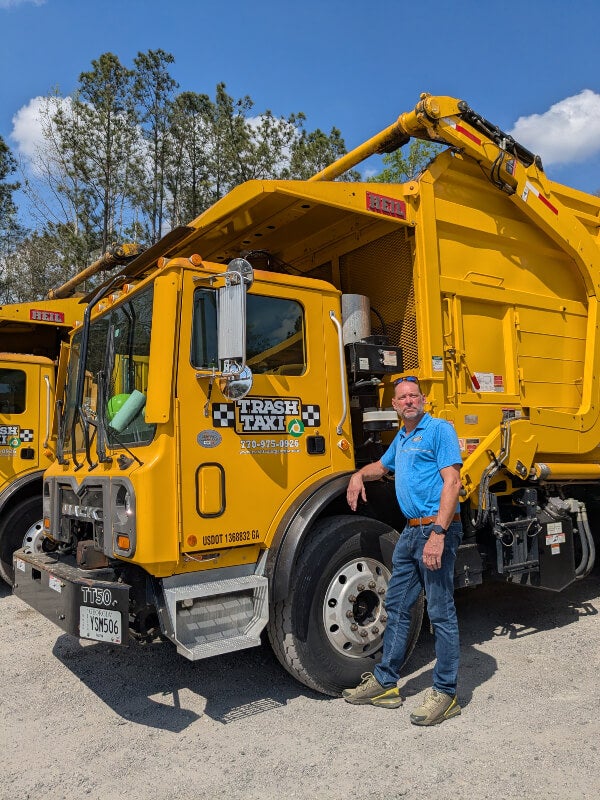 A trash collection truck in the Atlanta, GA Area