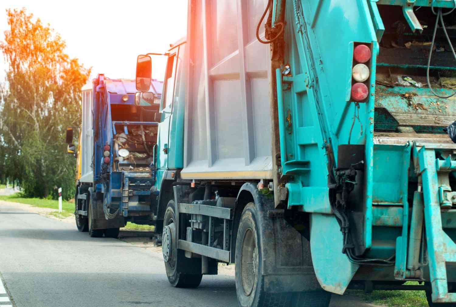 Bulk waste collection trucks transporting large, discarded items for disposal in Acworth, GA