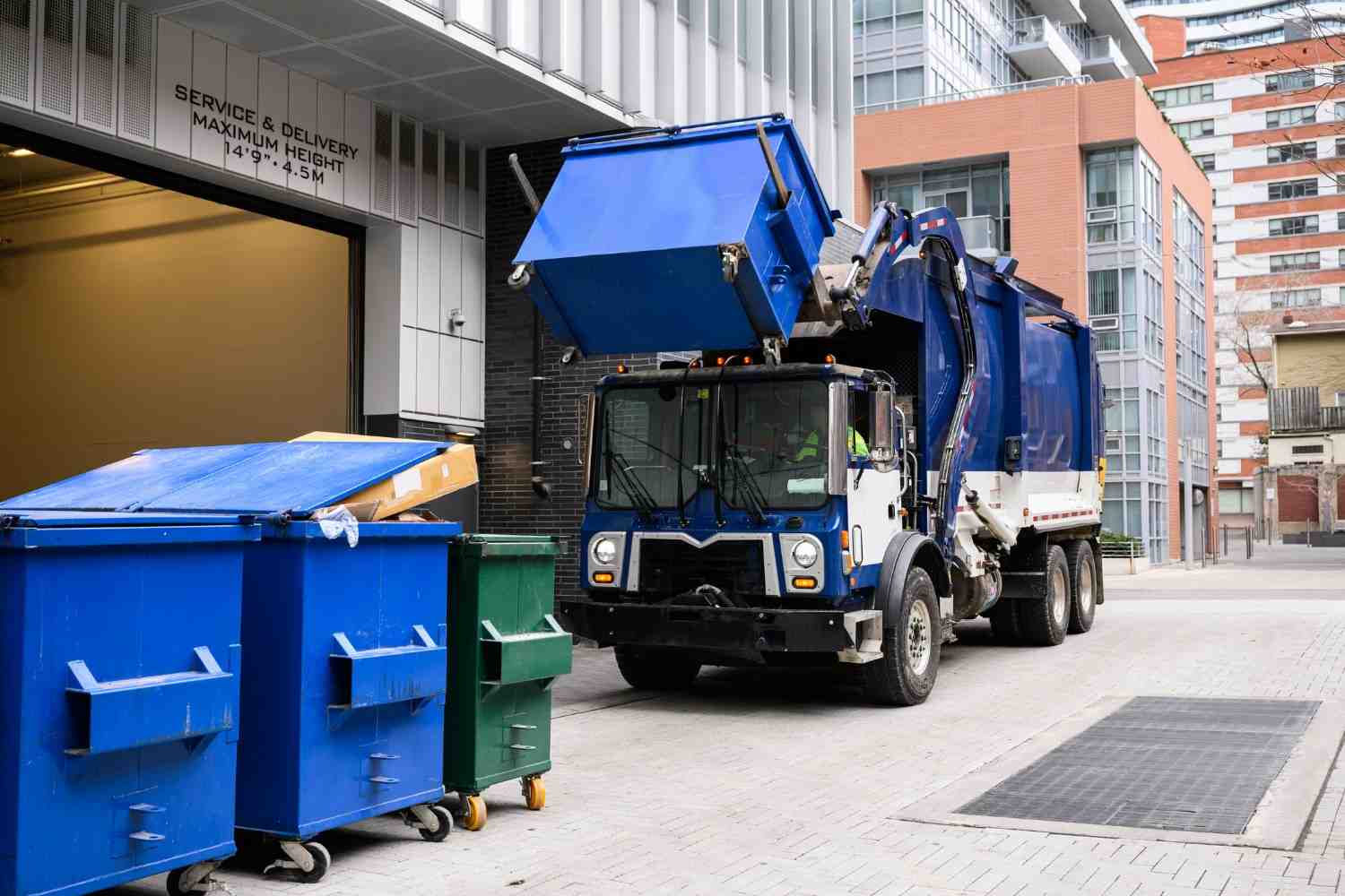 Commercial property cleanout project featuring dumpsters and waste collection equipment in Acworth, GA