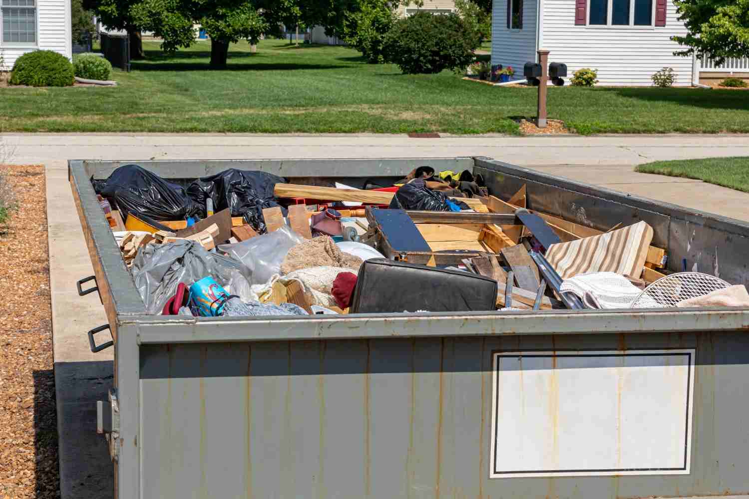 Loaded dumpster showing accepted waste materials in Acworth, GA
