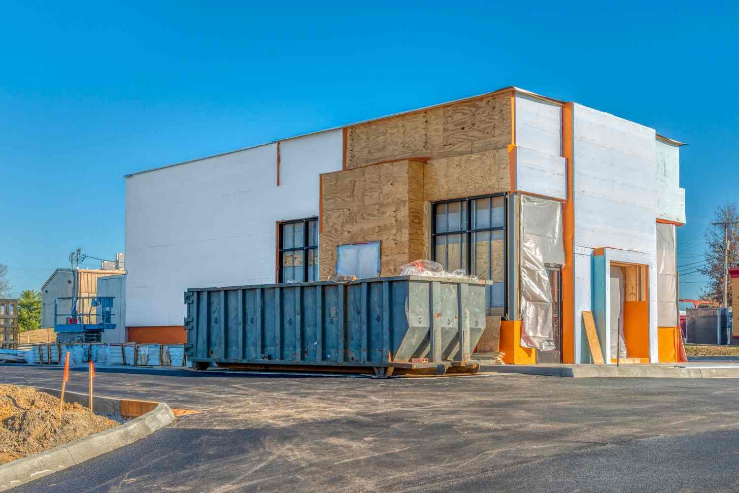 Large dumpster positioned outside a commercial property during a cleanout in Dallas, GA