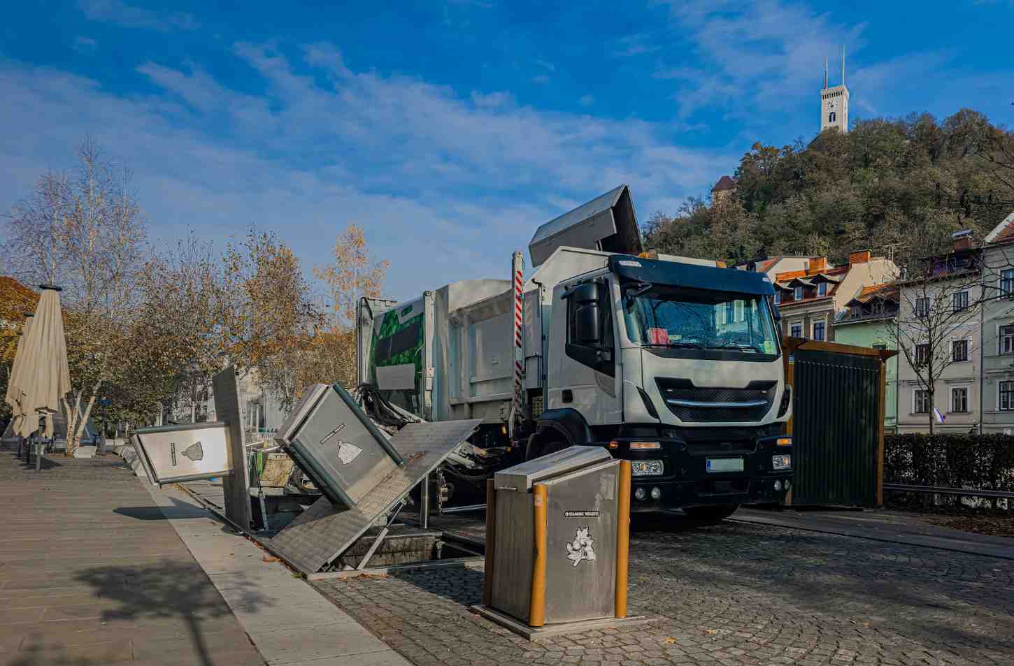 Waste sorting process with collection truck transporting debris from a disposal container in Acworth, GA